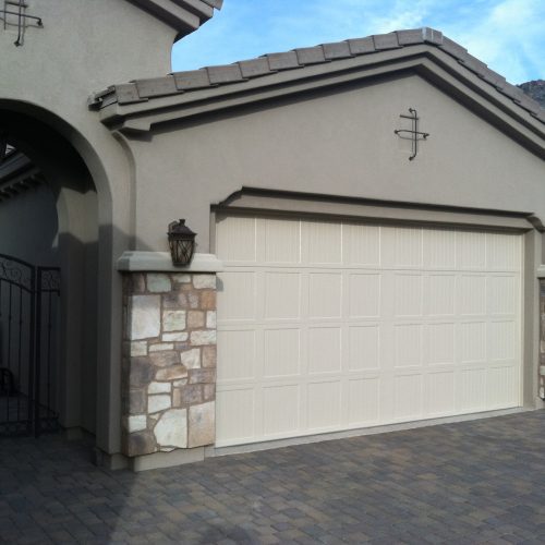 Double car garage door SteeLite Delano D1 model in wood grain texture