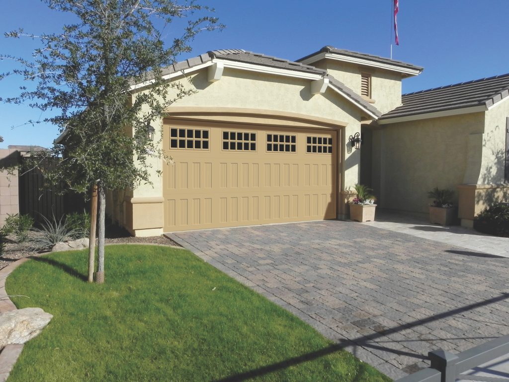 Double car garage door SteeLite Legacy L3 model in a sand color.