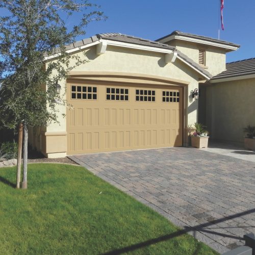 Double car garage door SteeLite Legacy L3 model in a sand color.